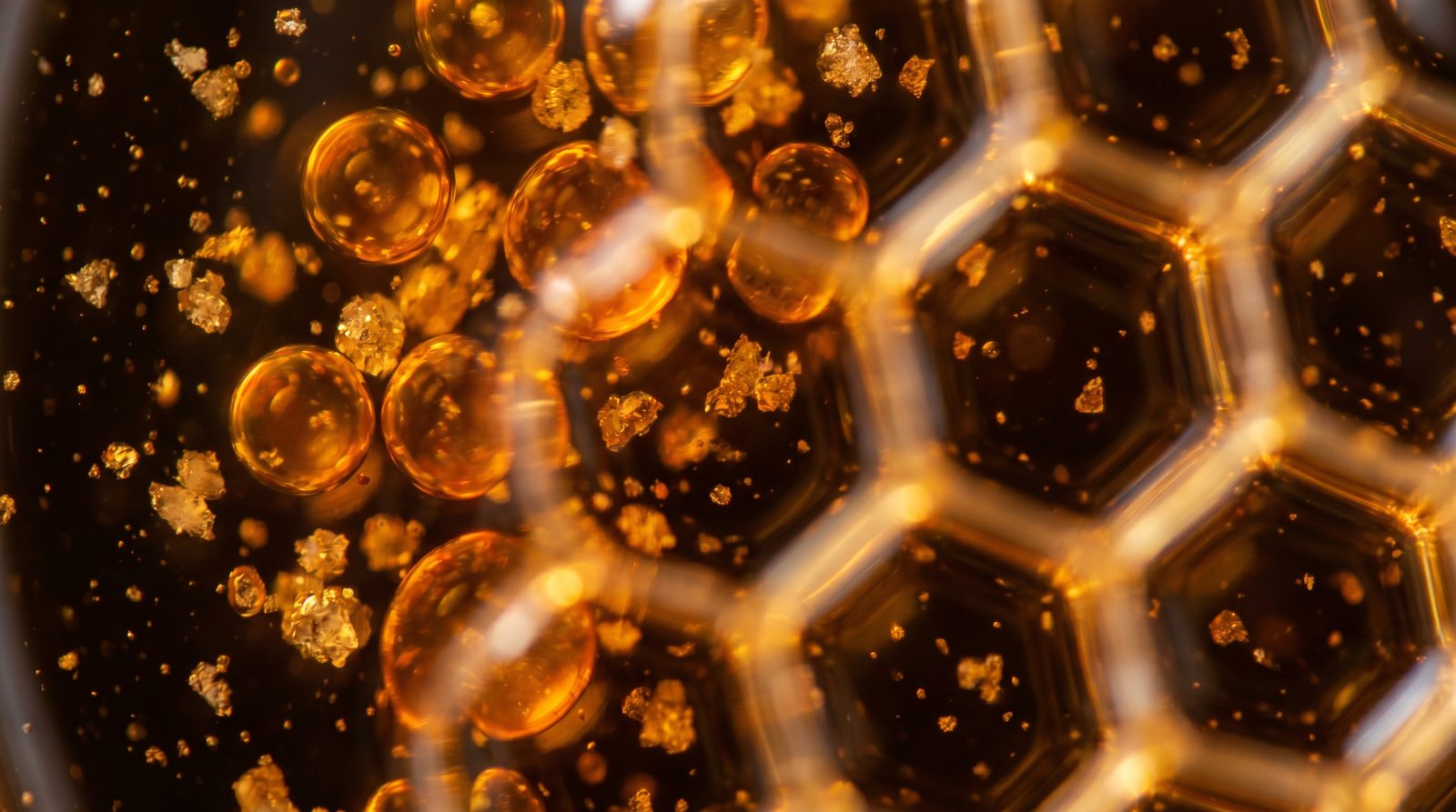 Abstract amber data points settling into a structured lattice